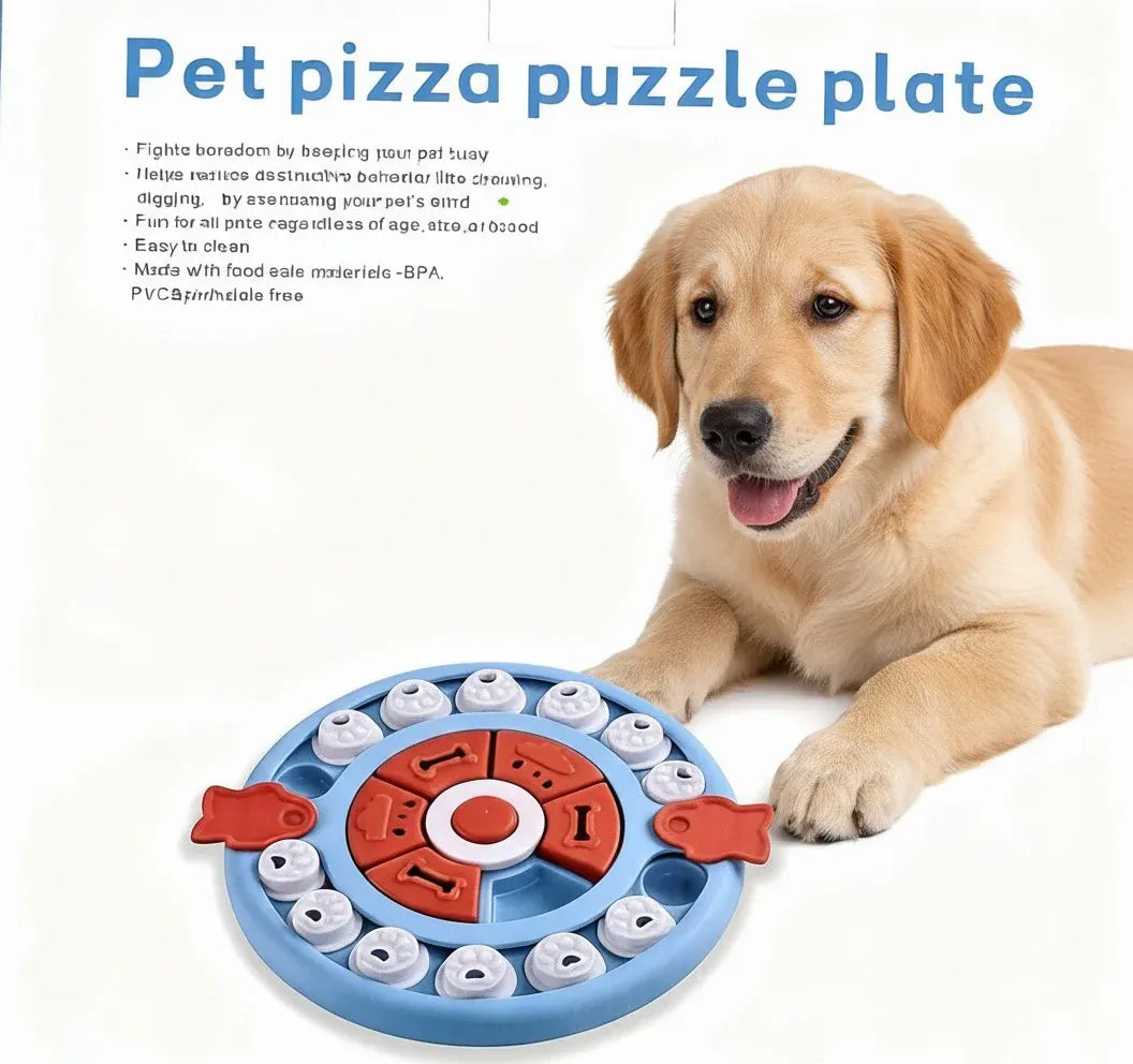 Golden retriever puppy lying behind the blue Pizza Puzzle treat toy