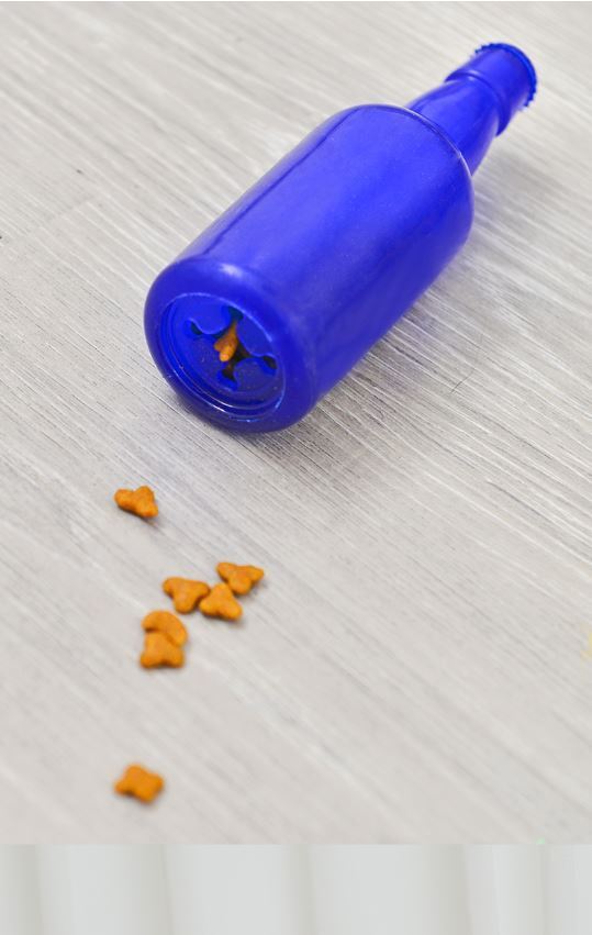 Blue Puppy Treat Toy with kibble spilling out onto a timber floor