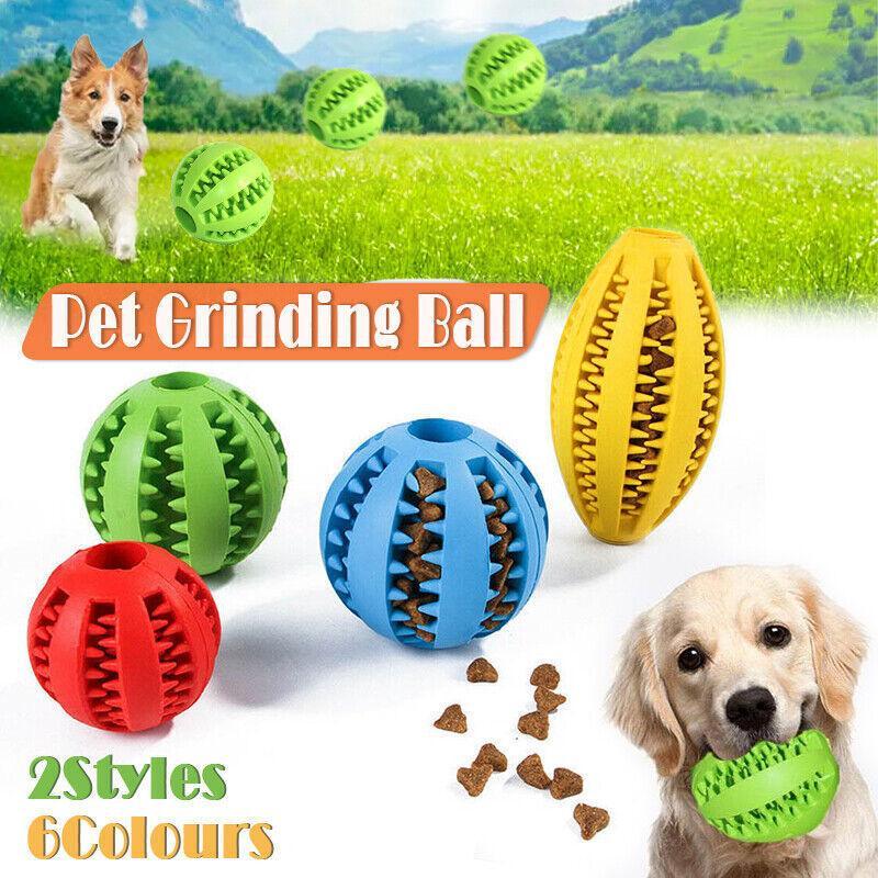 Rubber Treat Balls in several colours, with a retriever puppy holding one