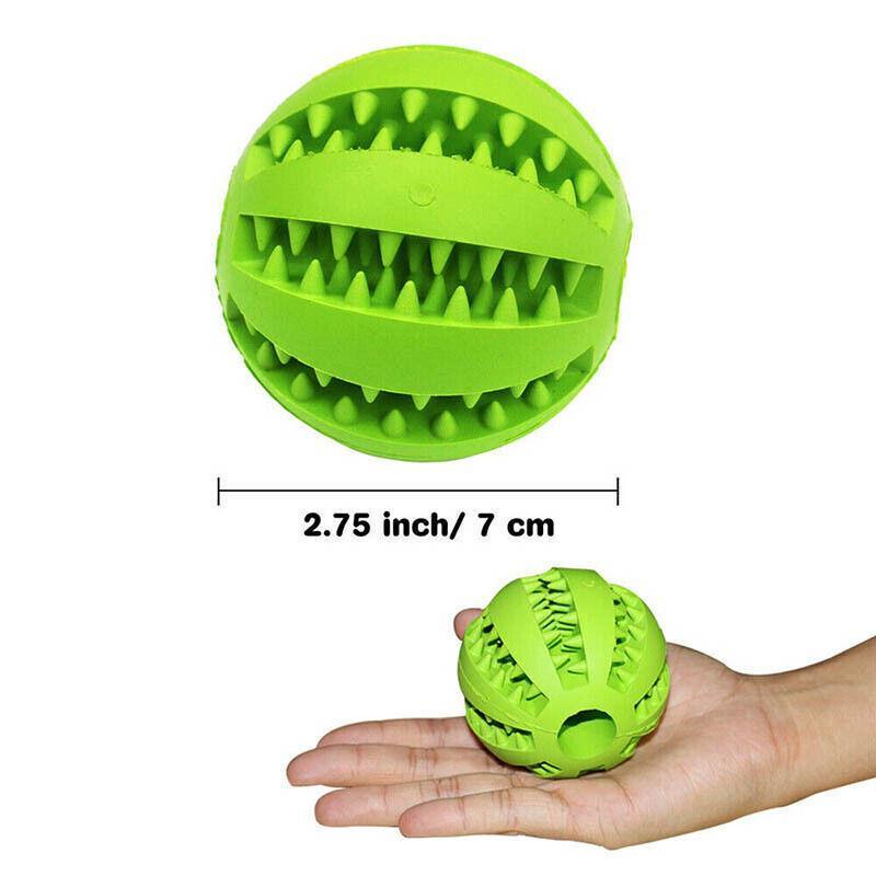 Green 7cm Rubber Treat Ball for small dogs held in an open hand
