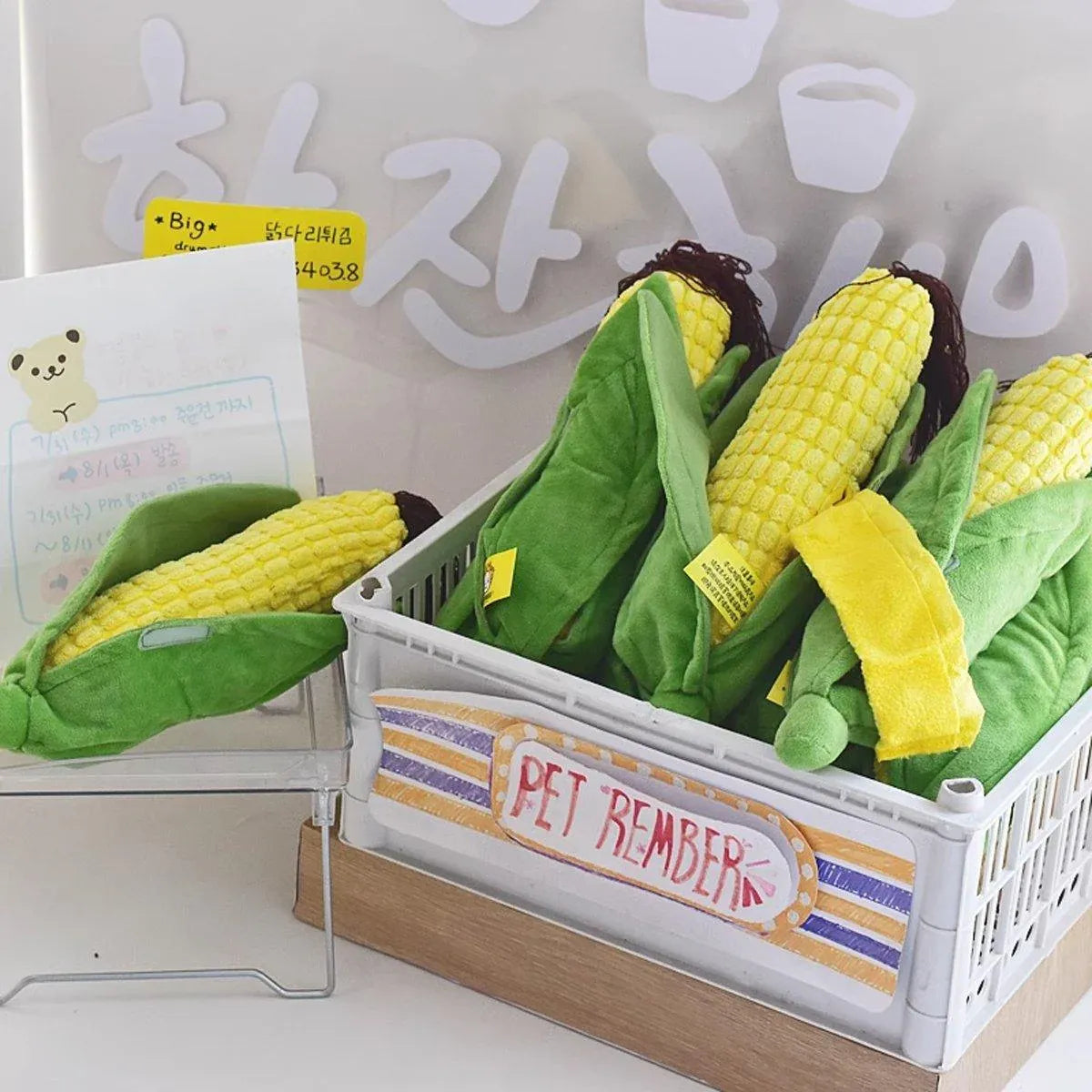 Basket of plush Corn Chew Toys on a shelf