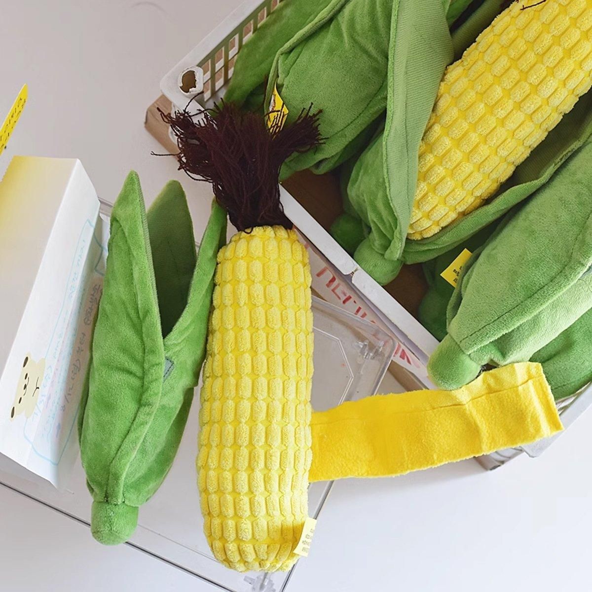 Corn Chew Toy standing upright beside a basket of corn toys