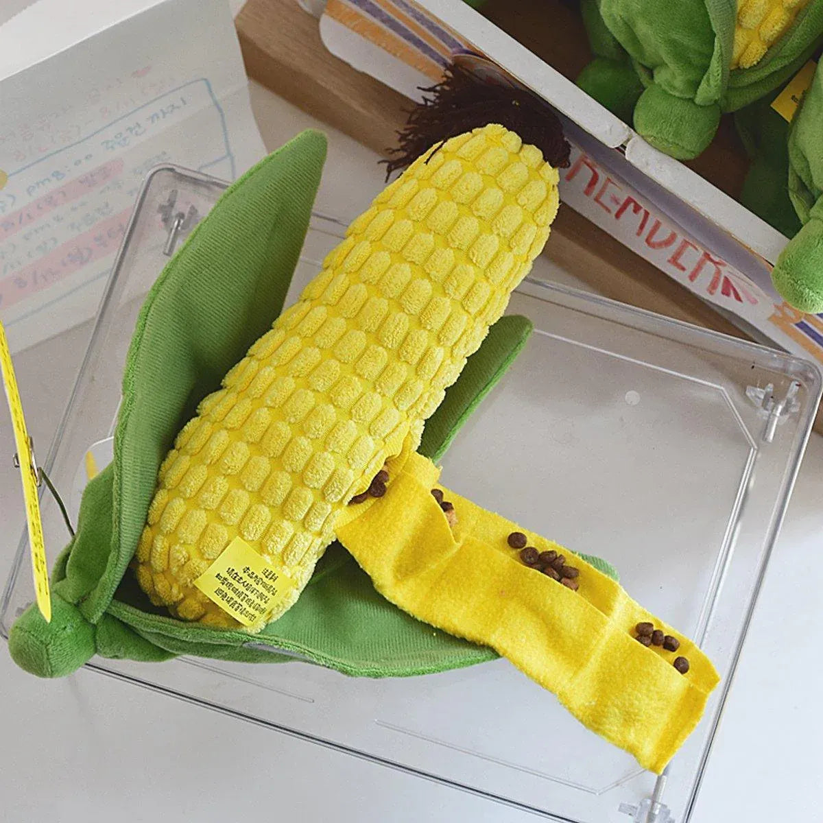 Plush Corn Chew Toy with kibble tucked into the yellow fabric strip