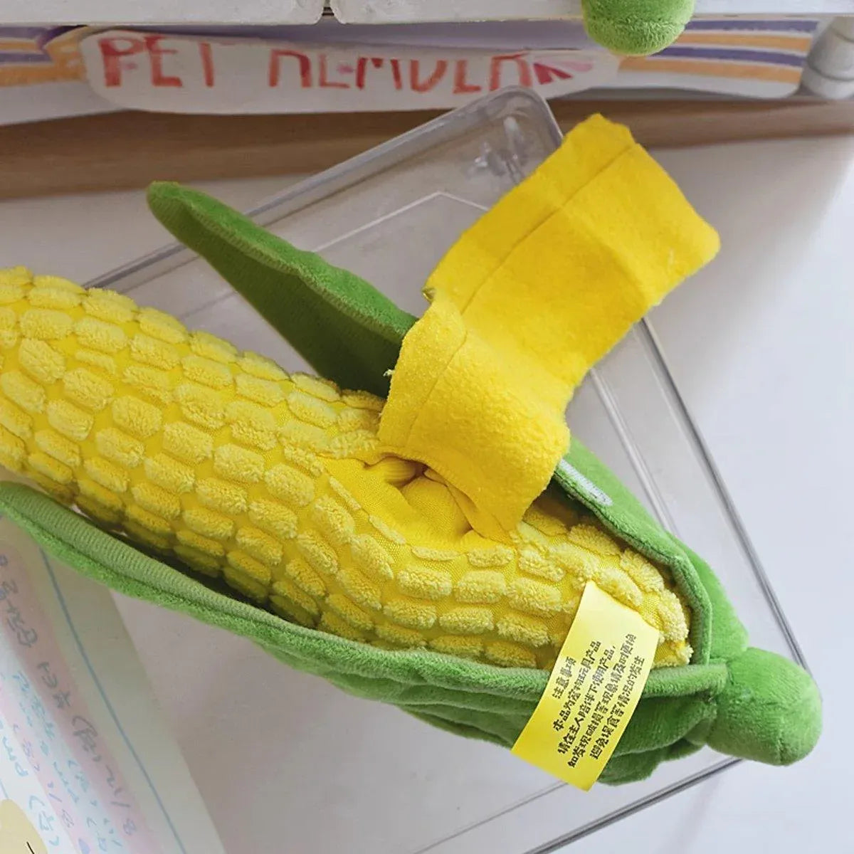 Close up of the textured kernels and yellow treat flap on the Corn Chew Toy