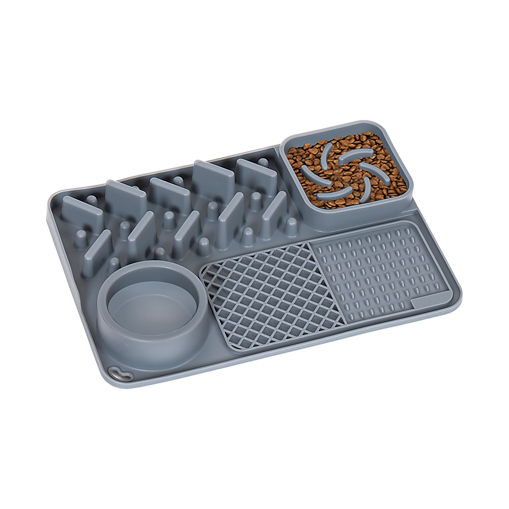 Grey Tough Lick Mat with a built-in bowl, ridges and textured zones, with food in one corner