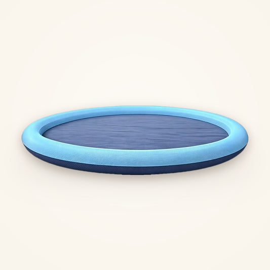 Round blue dog splash pad with a raised rim and grip base